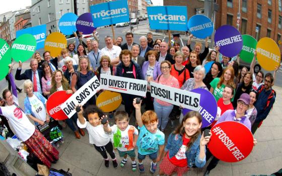 People celebrate July 12, 2018, after the passage of the Fossil Fuel Divestment Bill in Ireland. (Mark Stedman)