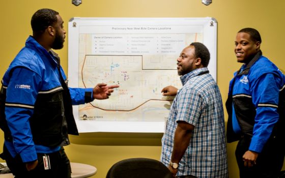  Community Prosecution Unit coordinator Bobby McQuay, center, and the Near West Side Partners ambassadors use geocoded data and resident input to address community identified issues on Milwaukee's Near West Side. (Courtesy of Near West Side Partners)