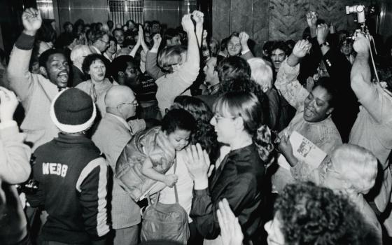 At the Joslyn Art Museum in Omaha, Nebraska, on April 14, 1982, members of Iowa Citizens for Community Improvement hear the news that InterNorth Inc. Board President Willis Strauss agrees to a meeting. (Courtesy of Omaha World Herald)