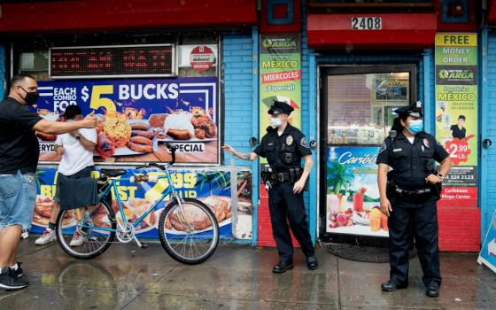 Camden County Police Officers Alexander Baldwin and Natalie Perez patrol on the streets of Camden, New Jersey, June 11. (Newscom/Reuters/Jessica Kourkounis)