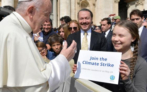 Pope Francis greets Swedish climate activist Greta Thunberg during his general audience in St. Peter's Square at the Vatican April 17, 2019. (CNS photo/Yara Nardi, Reuters)