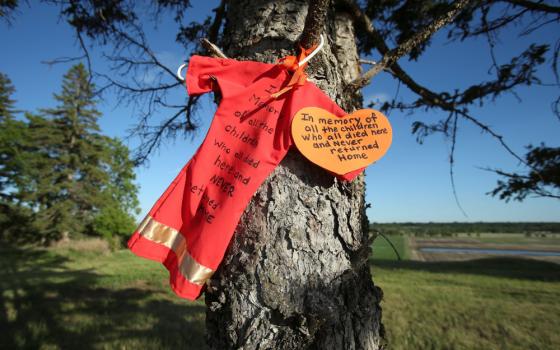 An offering is seen at the site of the former Brandon Indian Residential School June 12, 2021. Researchers — partnered with the Sioux Valley Dakota Nation — located 104 potential graves at the site in Brandon, Manitoba. (CNS/Reuters/Shannon VanRaes)