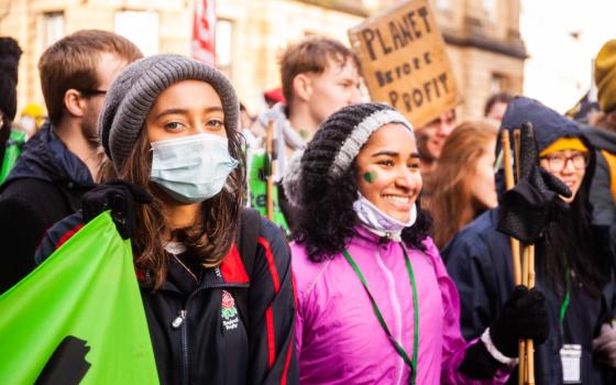 Young women from London join a protest during a Day of Action at the U.N. Climate Change Conference Nov. 6 in Glasgow, Scotland. (CNS/Courtesy of  CAFOD/Louise Norton)