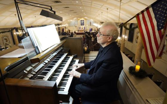 James Kendall plays the organ during an "Advent Lessons and Carols" service on the first Sunday of Advent Nov. 28 at Our Lady of Perpetual Help Church in Lindenhurst, New York. (CNS/Gregory A. Shemitz)