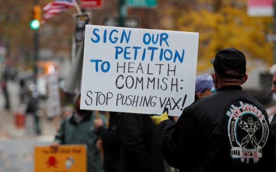 Protesters demonstrate outside the New York City Department of Health offices after New York City Mayor Bill de Blasio announced Dec. 6, 2021, that all employers in the private sector must implement COVID-19 vaccine mandates for their workers in New York 