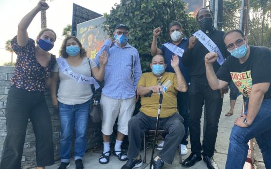 Jesuit Fr. Ike Udoh, second from right, poses with former Chateau Marmont employees on Aug. 25, 2021. (Photo courtesy of Maria Hernandez/United Here Local 11)