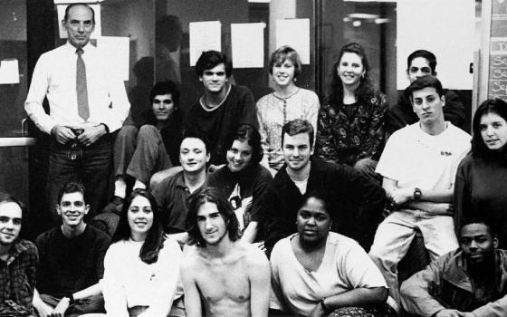 Jesuit Fr. Raymond A. Schroth, top left, poses with staff of The Maroon, the student newspaper of Loyola University New Orleans, for a yearbook photo in 1994. (The Wolf yearbook archives)