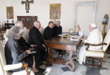 Pope Francis meets with leaders of the Synod of Bishops' general secretariat in the library of the Apostolic Palace at the Vatican Oct. 14. Pictured with the pontiff are Xavière Missionary Sr. Nathalie Becquart, undersecretary; Bishop Luis Marín de San Martín, undersecretary; Cardinal Jean-Claude Hollerich of Luxembourg, relator general; Cardinal Mario Grech, secretary-general; and Jesuit Father Giacomo Costa, consultant. (CNS/Vatican Media)