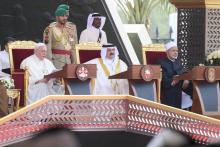 Pope Francis addresses the Bahrain Forum for Dialogue: East and West for Human Coexistence Nov. 4, 2022, in Awali, Bahrain. Bahrain's King Hamad bin Isa Al Khalifa and Sheikh Ahmad el-Tayeb, grand imam of Egypt's Al-Azhar mosque and university, look on. (CNS photo/Vatican Media)