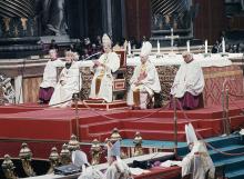 Pope Paul VI proclaims the last decrees of the Second Vatican Council, sitting on his throne before the papal altar under Bernini's bronze canopy in St. Peter's Basilica in Vatican City, Dec. 7, 1965. (AP)