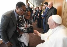 Pope Francis greets participants after speaking at a Vatican conference, "Pastors and lay faithful called to walk together," Feb. 18, 2023, in the Vatican synod hall. The meeting was sponsored by the Dicastery for Laity, the Family and Life. This October's meeting on the future of the church will take place in the larger Pope Paul VI audience hall.  (CNS/Vatican Media)