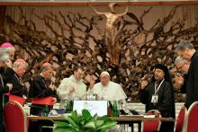 Pope Francis gives his blessing to members of the Synod of Bishops on synodality after the synod's final working session Oct. 26 in the Paul VI Audience Hall at the Vatican. The synod assembly released its final report after meeting in sessions since Oct. 2. (CNS/Vatican Media)