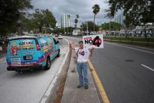 Sonja Kahkonen, an anti-abortion Catholic, holds a sign urging voters to reject Amendment 4, which would have enshrined abortion rights in Florida, on Nov. 5 outside a polling place at the Coliseum in St. Petersburg. The amendment won support from 57% of voters, but required 60% voter approval to amend the state constitution. (AP/Rebecca Blackwell)