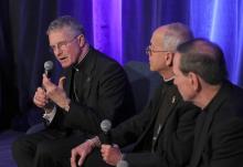 Archbishop Timothy Broglio of the U.S. Archdiocese for the Military Services, president of the U.S. Conference of Catholic Bishops, speaks during a news conference at a Nov. 12 session of the conference's fall general assembly in Baltimore. Also pictured are Bishops Mark Seitz of El Paso, Texas, and Michael Burbidge of Arlington, Virginia. (OSV News/Bob Roller)