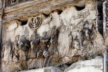 A relief on the first-century Arch of Titus in Rome depicts a triumphal procession with spoils from the destruction of the Temple in Jerusalem. (Wikimedia Commons/David Castor)