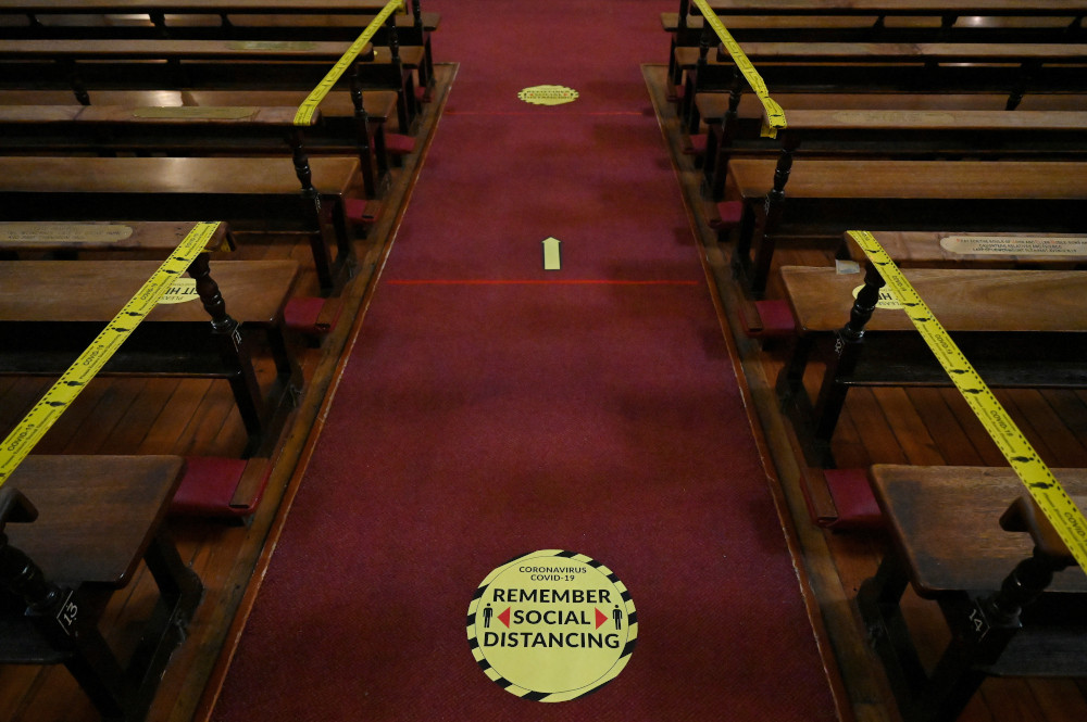 Pews are taped off and social distancing markers are pictured at the Church of Mary Immaculate Refuge of Sinners during Mass in Dublin Feb. 17, 2021, during the COVID-19 pandemic. (CNS/Reuters/Clodagh Kilcoyne)