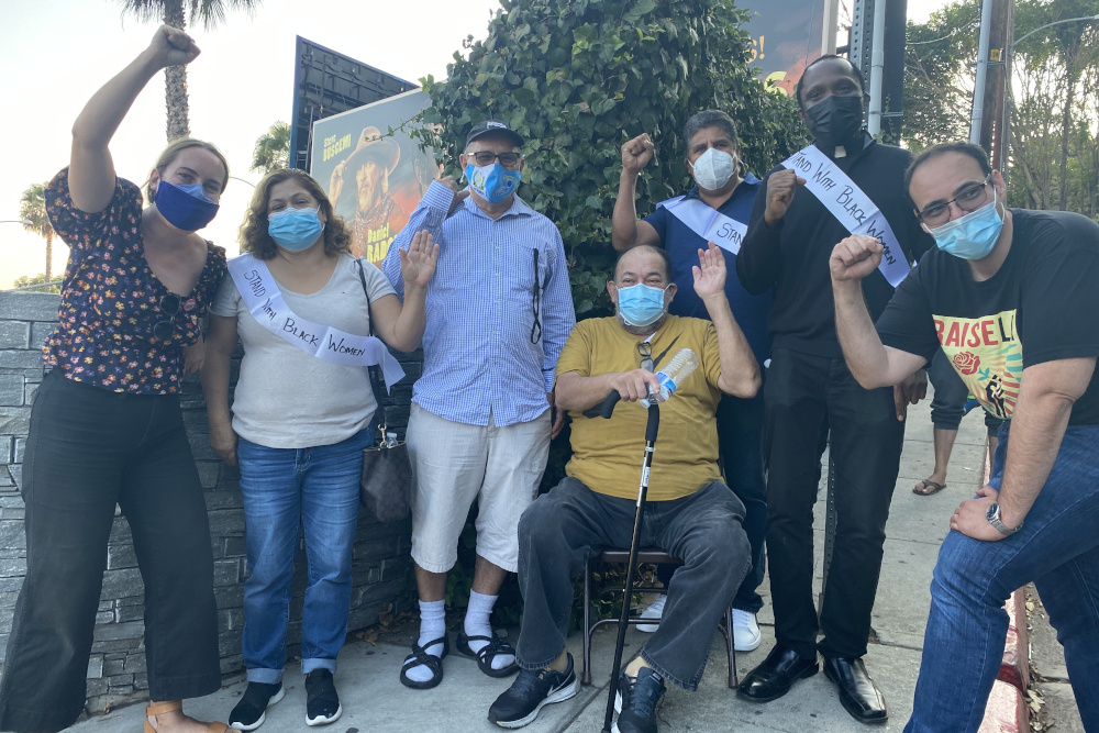 Jesuit Fr. Ike Udoh, second from right, poses with former Chateau Marmont employees on Aug. 25, 2021. (Photo courtesy of Maria Hernandez/United Here Local 11)