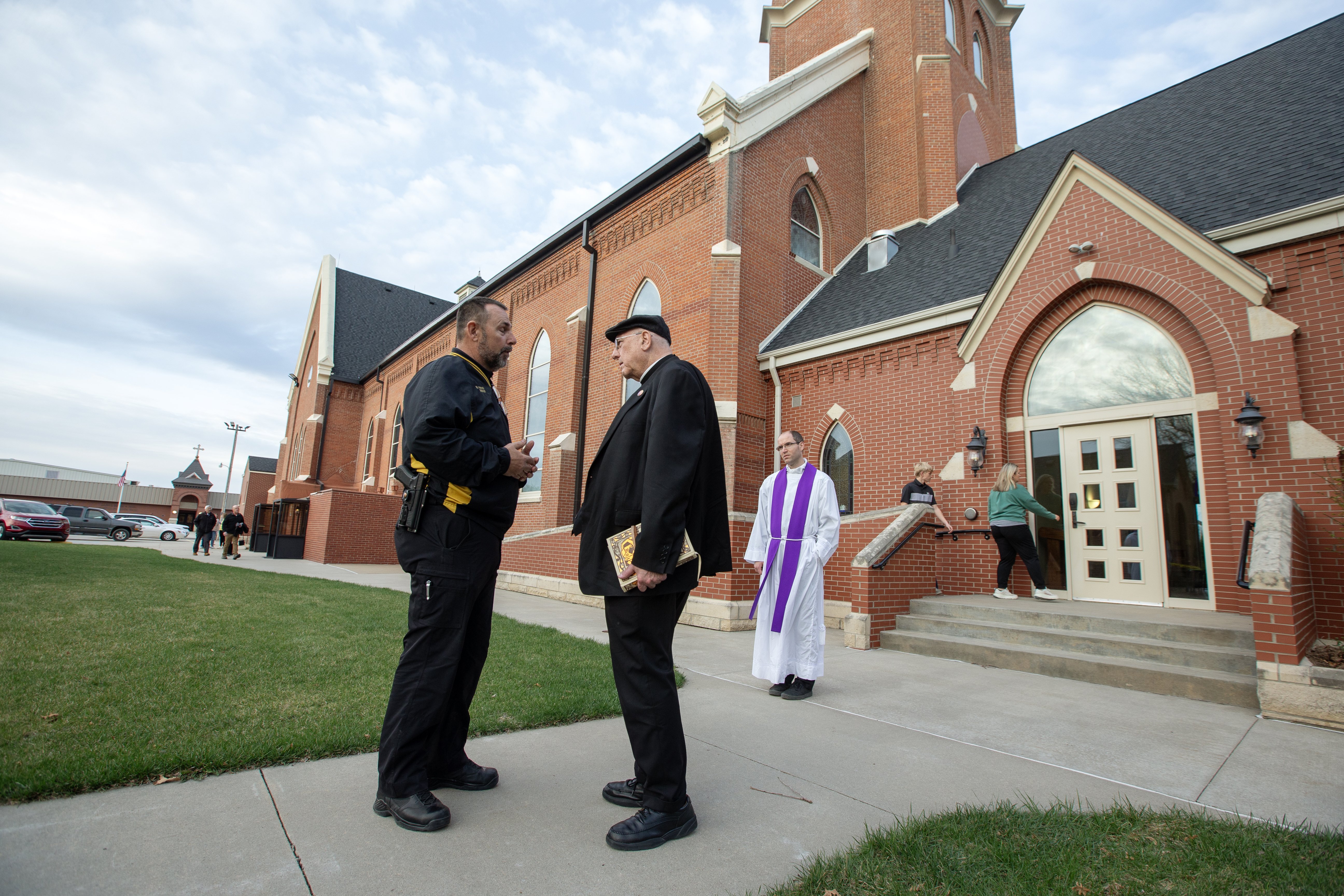 Sheriff Richard Vernon of Nemaha County, Kan., talks with Archbishop Joseph F. Naumann of Kansas City outside of Sts. Peter and Paul Church in Seneca, Kan., April 3, 2025. Earlier that day, Sts. Peter and Paul's pastor, Father Raj "Arul" Carasala, 57, was fatally shot in front of the parish rectory. (OSV News photo/Jay Soldner, The Leaven)