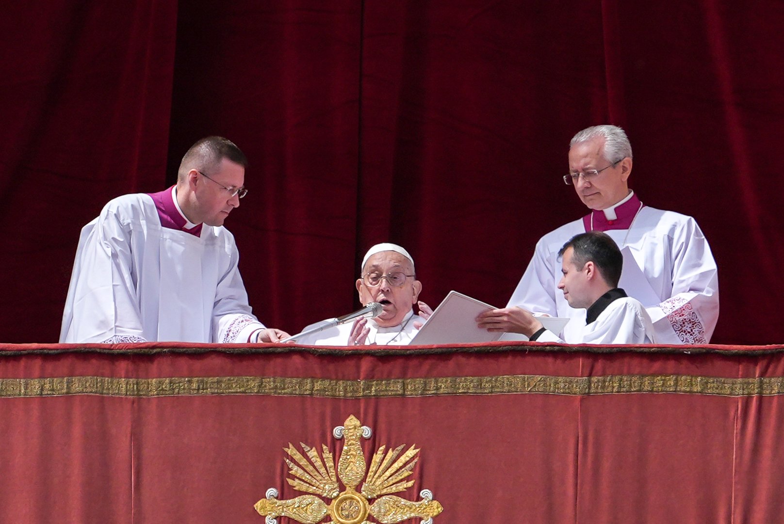 Pope Francis greets the crowd before delivering his Easter blessing "urbi et orbi" (to the city and the world) from the central balcony of St. Peter's Basilica at the Vatican April 20, 2025. (CNS photo/Lola Gomez)