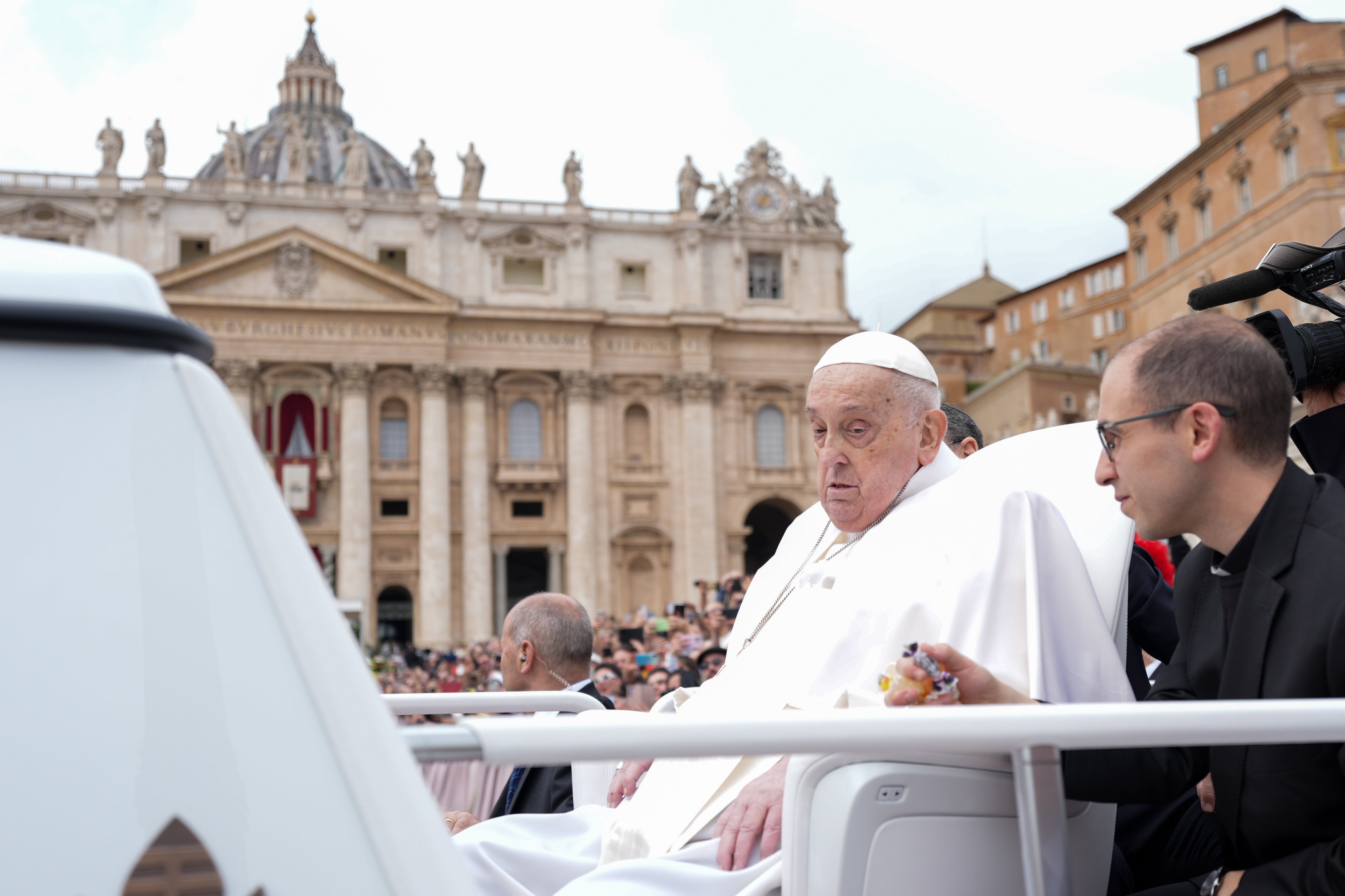 Pope Francis greets people from the popemobile 