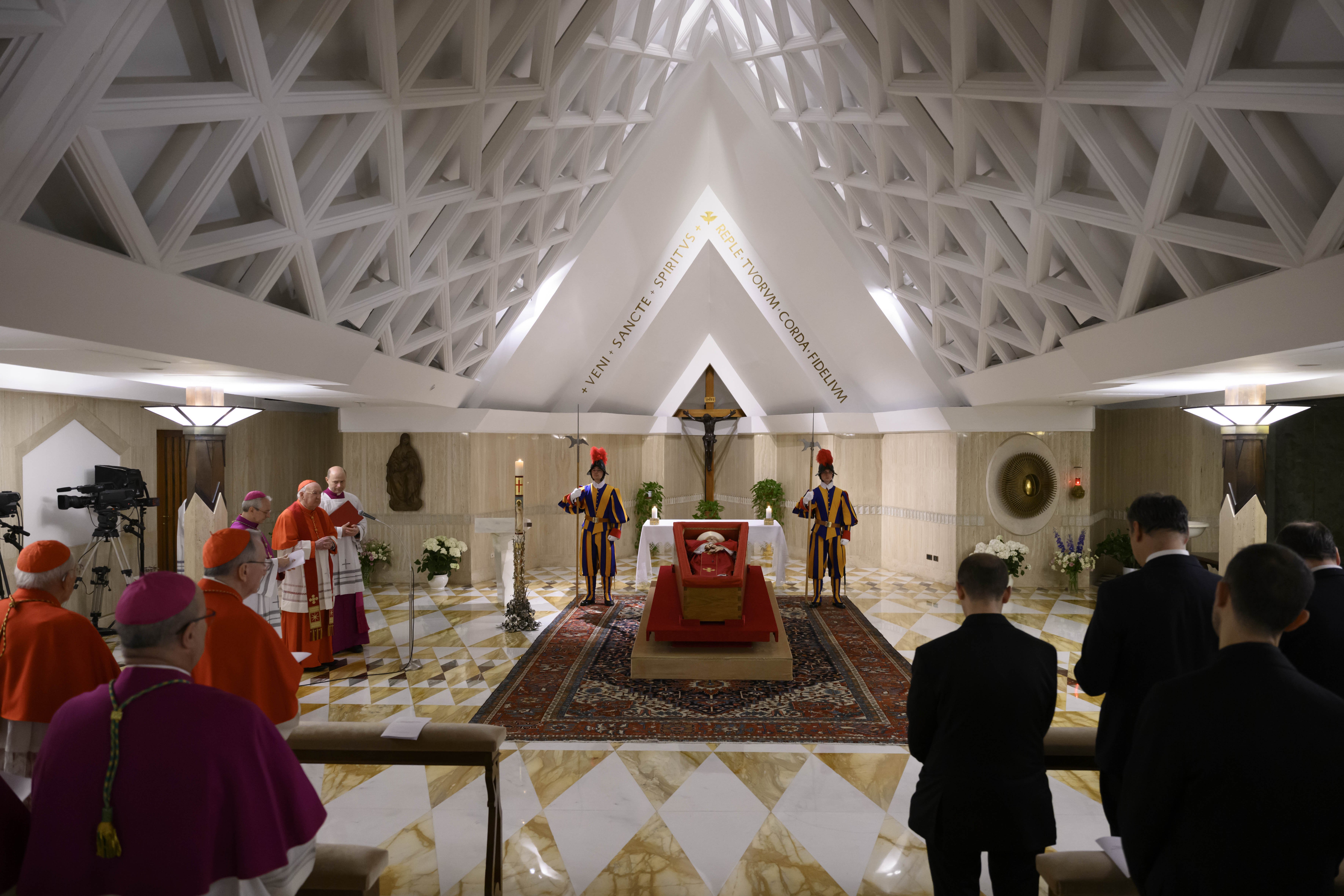 Pope Francis lies at rest in his coffin in the chapel of his residence, the Domus Sanctae Marthae, at the Vatican as cardinals and his closest aides pray April 21, 2025. (CNS photo/Vatican Media)