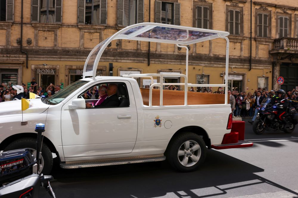 Pope Francis' casket is driven through the center of Rome on the way to his burial in the Basilica of Santa Maria Maggiore. (CNS/Kendall McLaren)
