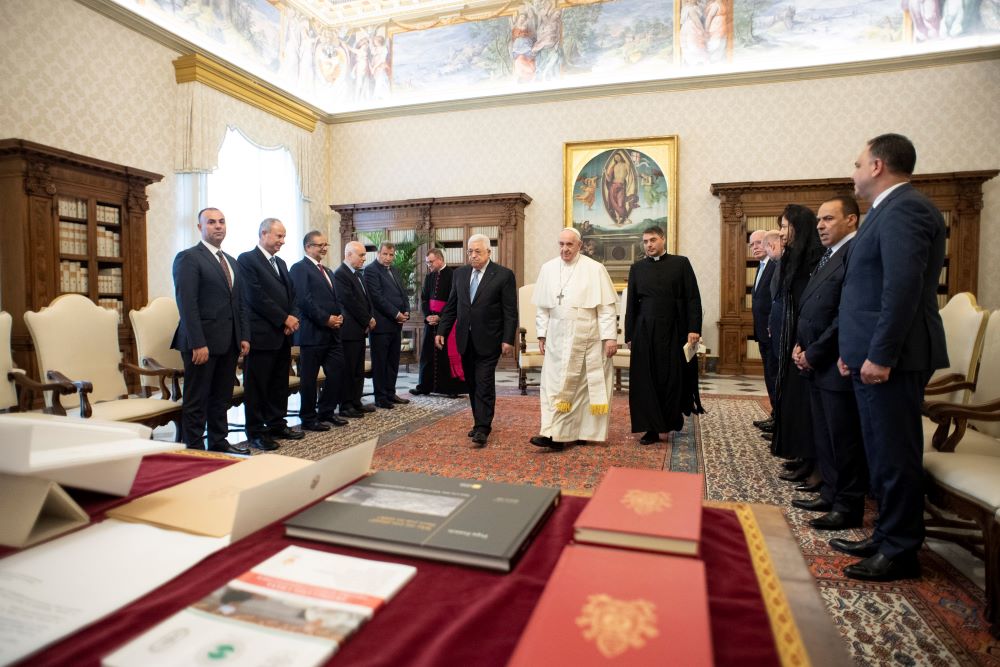 Pope Francis walks with Palestinian President Mahmoud Abbas during an audience at the Vatican Nov. 4, 2021. The Vatican in 2015 signed an agreement recognizing the state of Palestine. (CNS/Vatican Media)