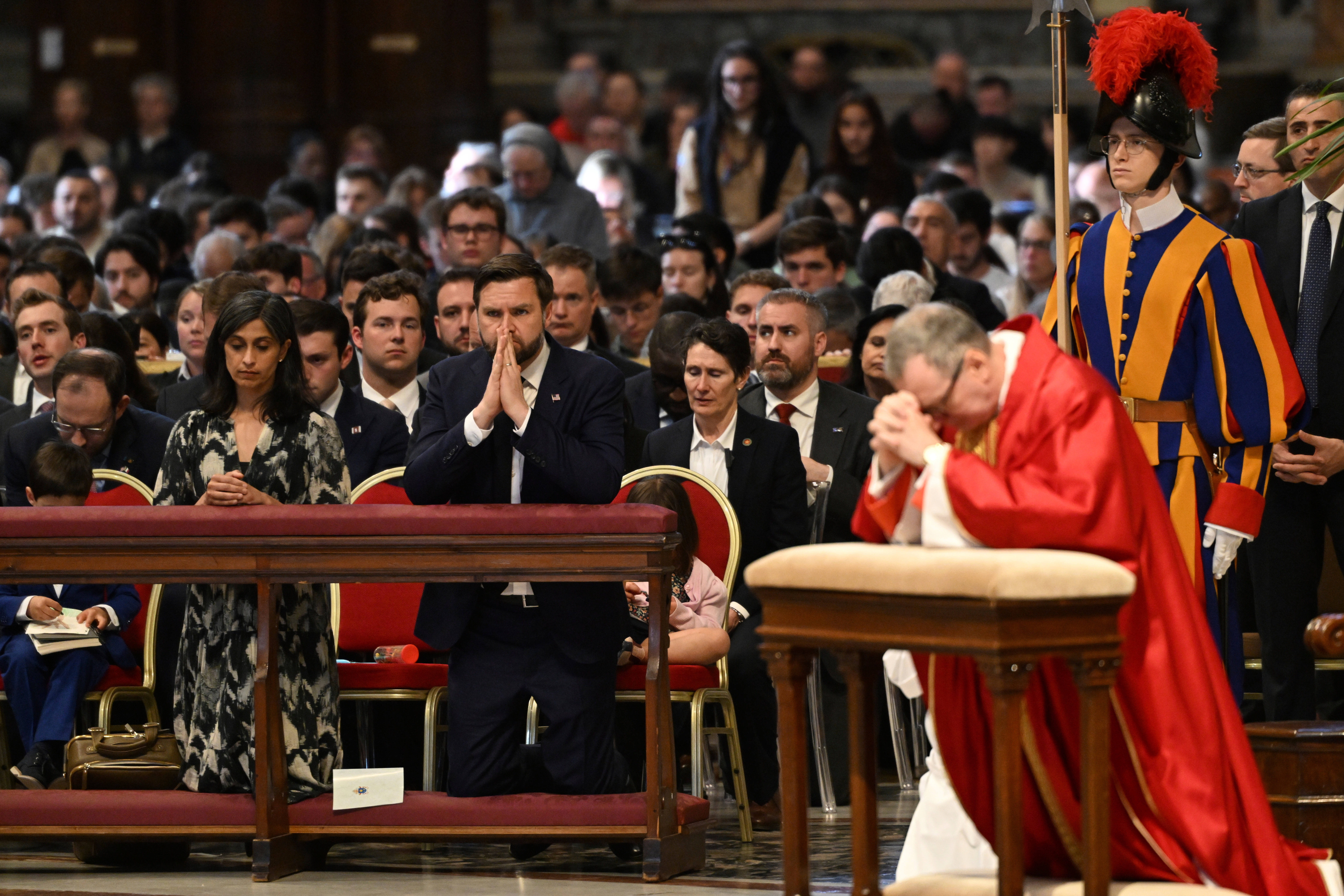 JD Vance attends the Good Friday mass in St. Peter's Basilica at the Vatican, Friday, April 18, 2025. (Kenny Holston/The New York Times via AP, Pool)