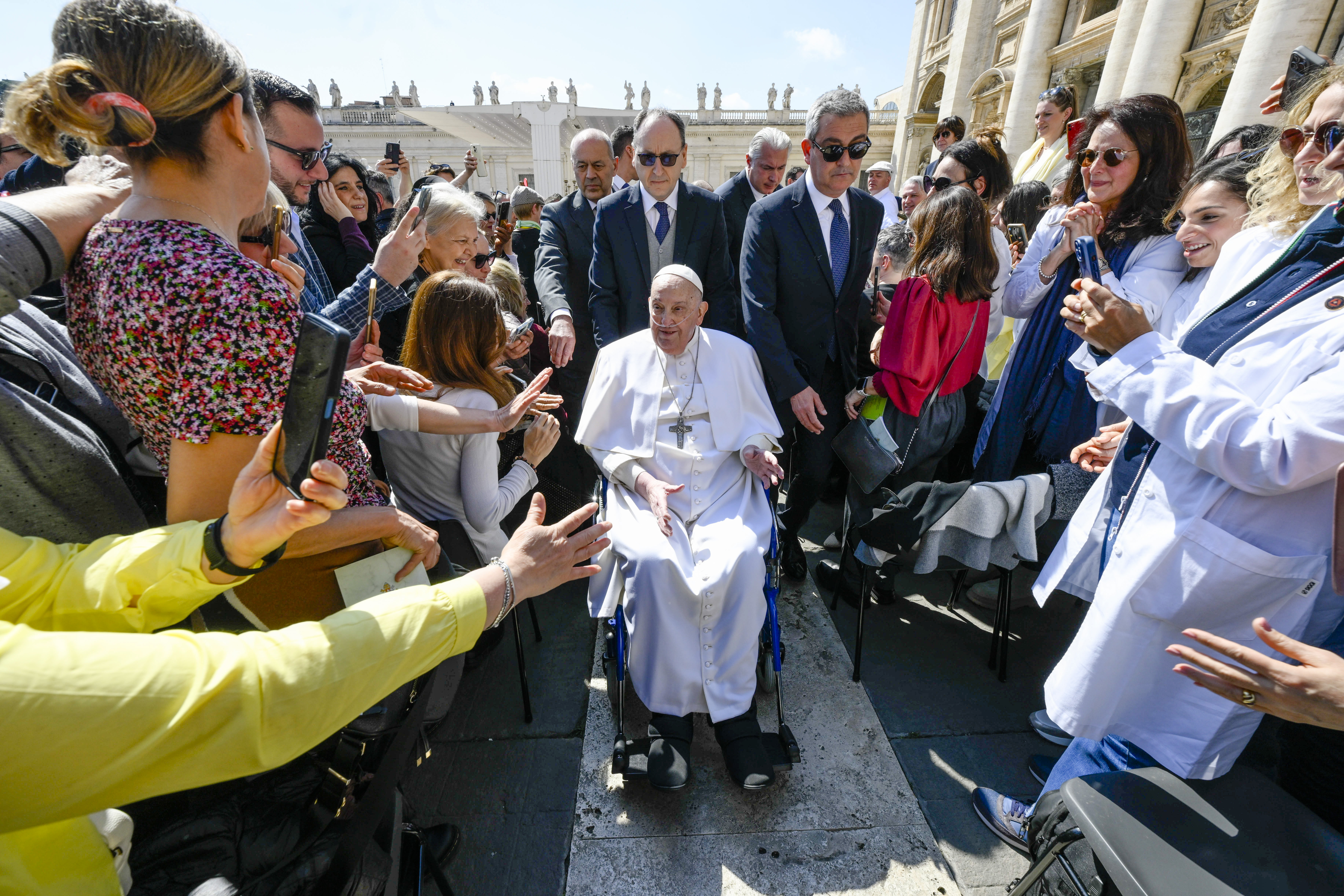 In this image released by Vatican Media, Pope Francis arrives in a wheelchair at the end of a Mass in St. Peter's Square at the Vatican, Sunday, April 6, 2025, part of the Jubilee of the sick and the health workers. (Vatican Media via AP)