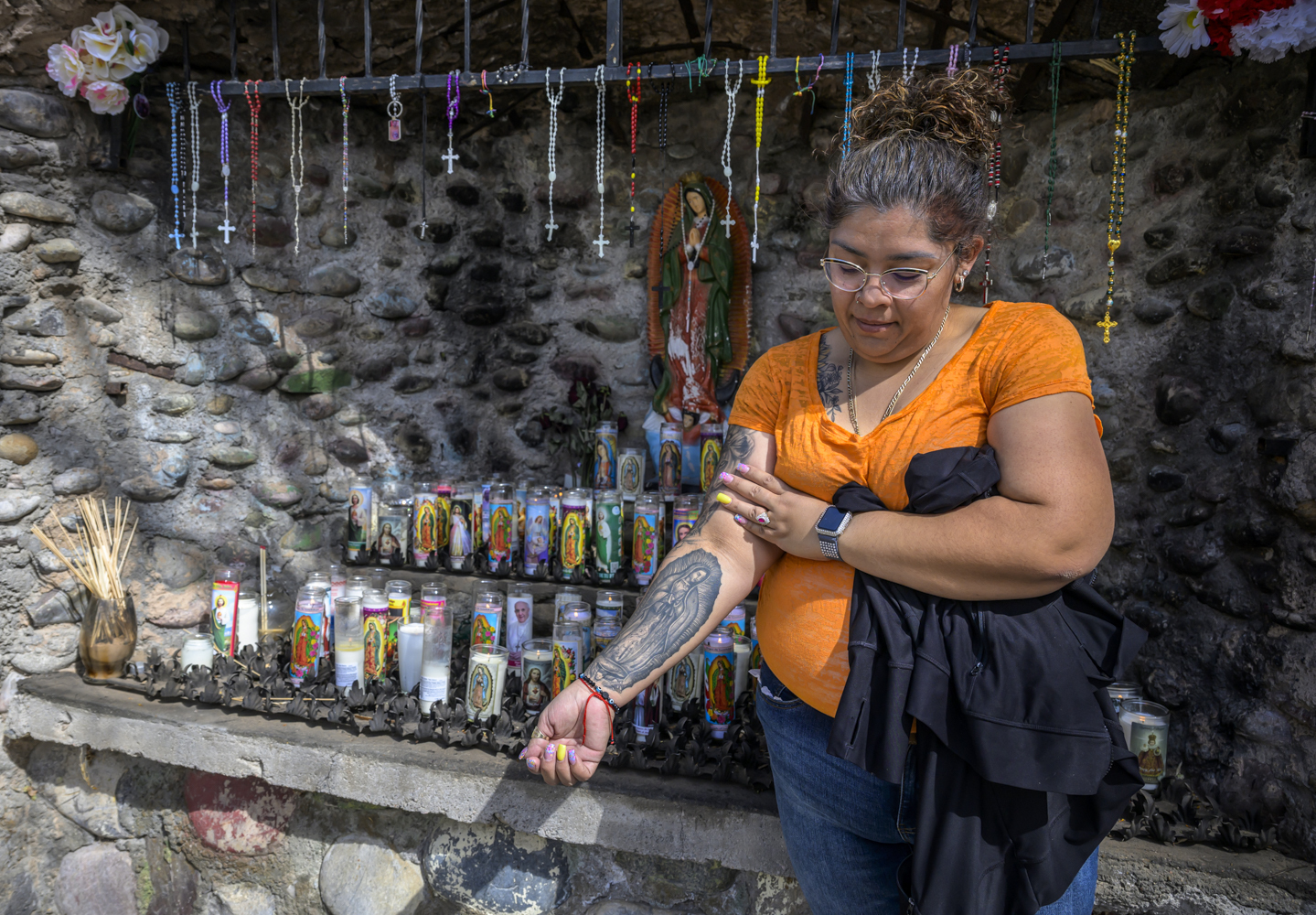 Roxanne Castillo of Albuquerque proudly displays her Virgen the Guadalupe tattoo after praying at an altar near El Santuario De Chimayo in Northern New Mexico on Good Friday, April 18, 2025. Chimayo, N.M.
