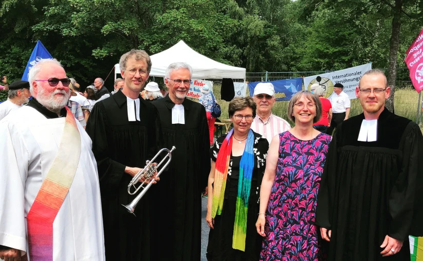 Deacon HoPe Raguth (left) gathers with members of Pax Christi Germany at a church action day in Büchel, Germany, near his diocese in Trier. 