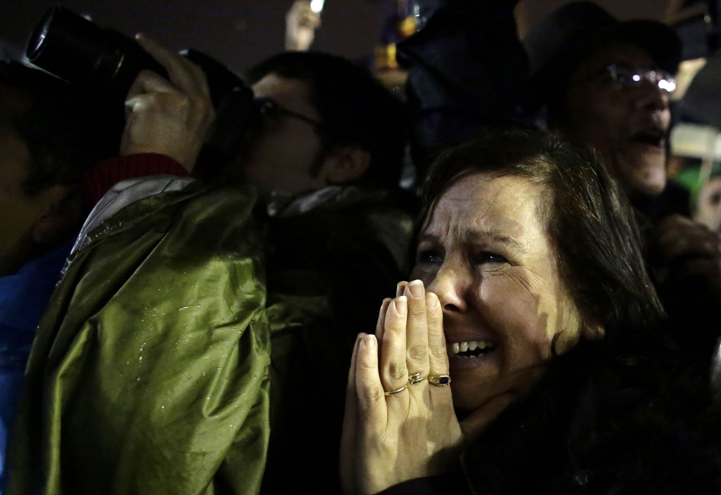 A woman reacts after Pope Francis was elected
