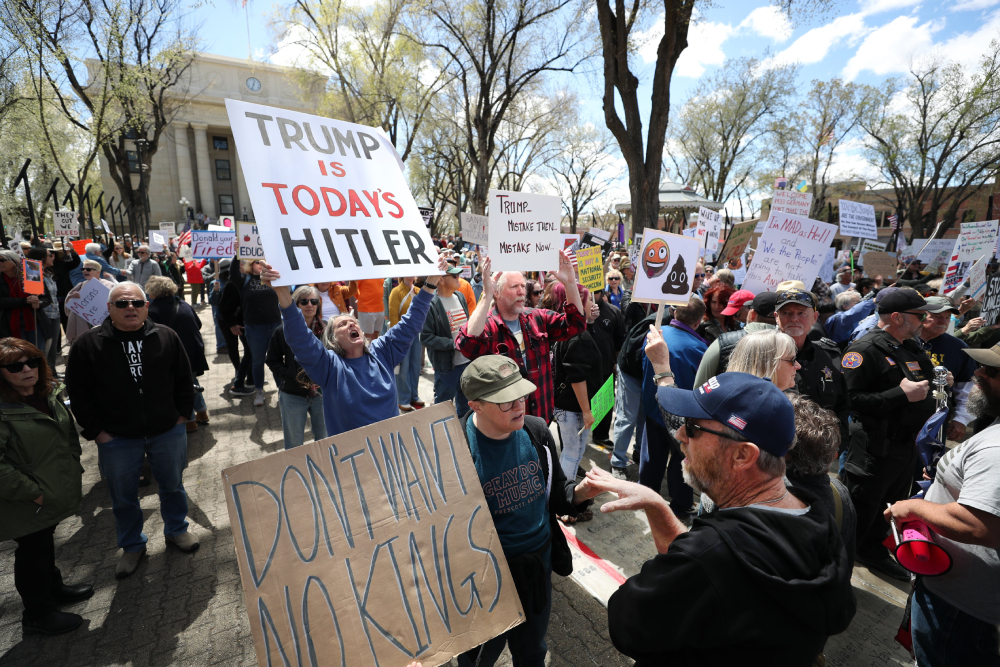 A protester confronts a counter-protester as a large crowd gathers outside the courthouse in Prescott, Ariz., April 5, 2025, to protest against U.S. President Donald Trump's administration. Opponents of Trump and billionaire Elon Musk rallied across the U.S. to protest the administration’s actions on government downsizing, the economy, human rights and other issues. (OSV News/Bob Roller)