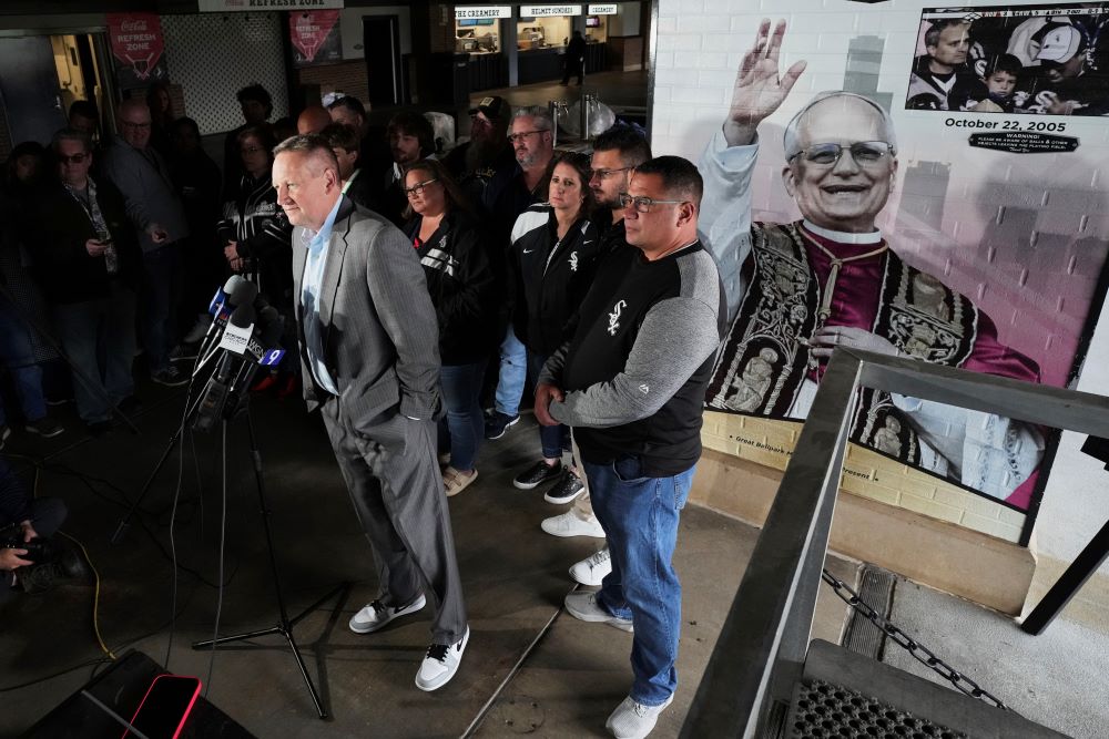 Press conference with sign honoring Pope Leo XIV