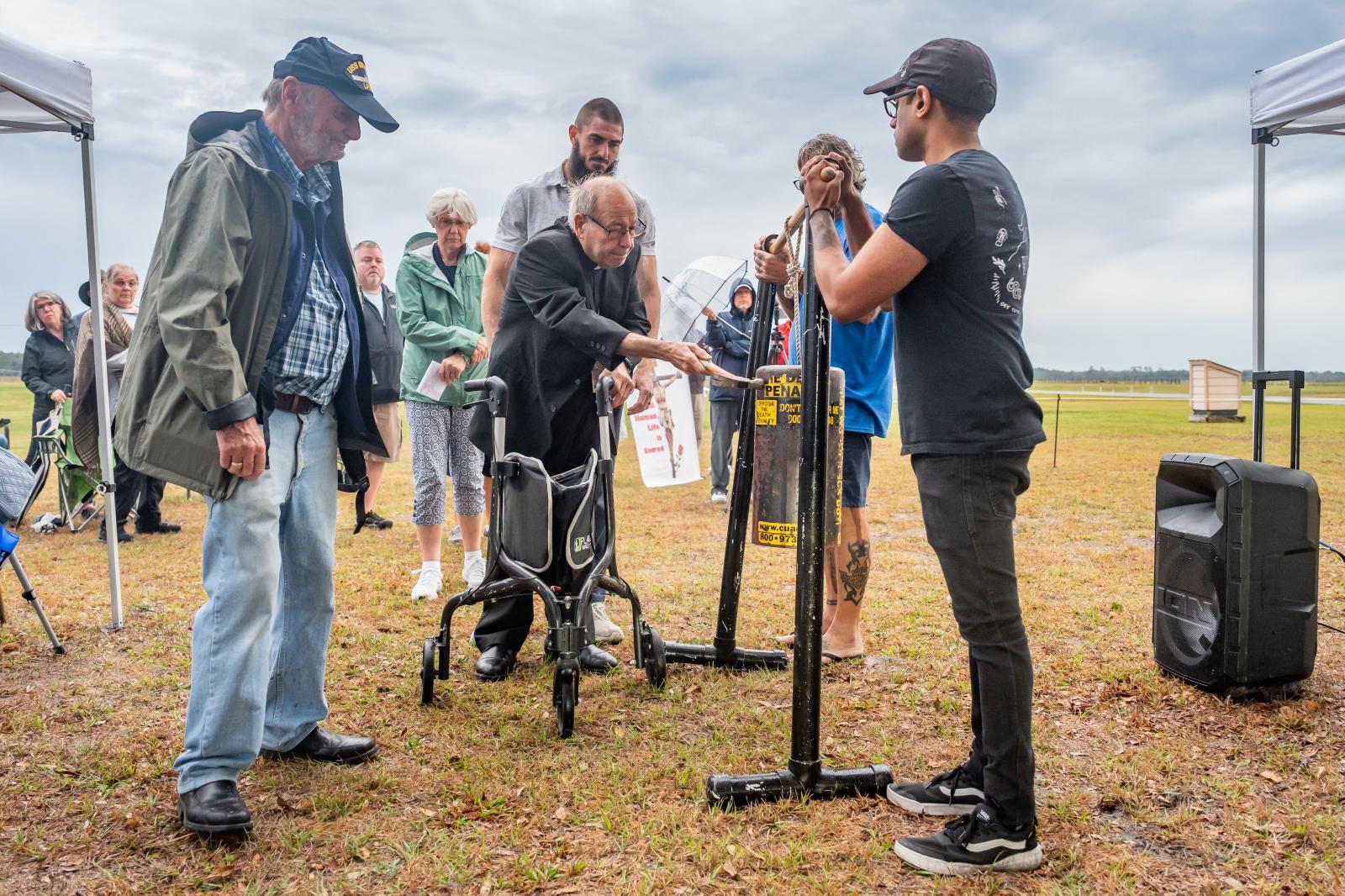 Retired Bishop Felipe J. Estévez of St. Augustine, Fla., joins people from across Florida for a prayer vigil outside Florida State Prison in Raiford on Feb. 13, 2025.