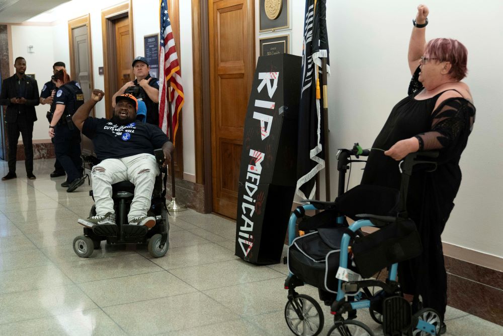 Demonstrators on wheelchairs protest outside the office of Sen. Bill Cassidy, Republican of Louisiana, regarding the proposed cuts to Medicaid, on Capitol Hill in Washington, June 11, 2025. (AP/Jose Luis Magana)