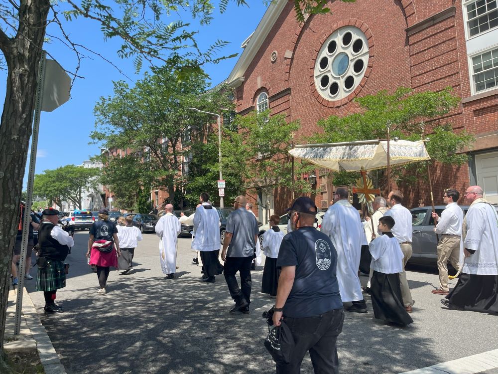 A bagpiper plays as the procession reached the Gate of Heaven Church in South Boston.