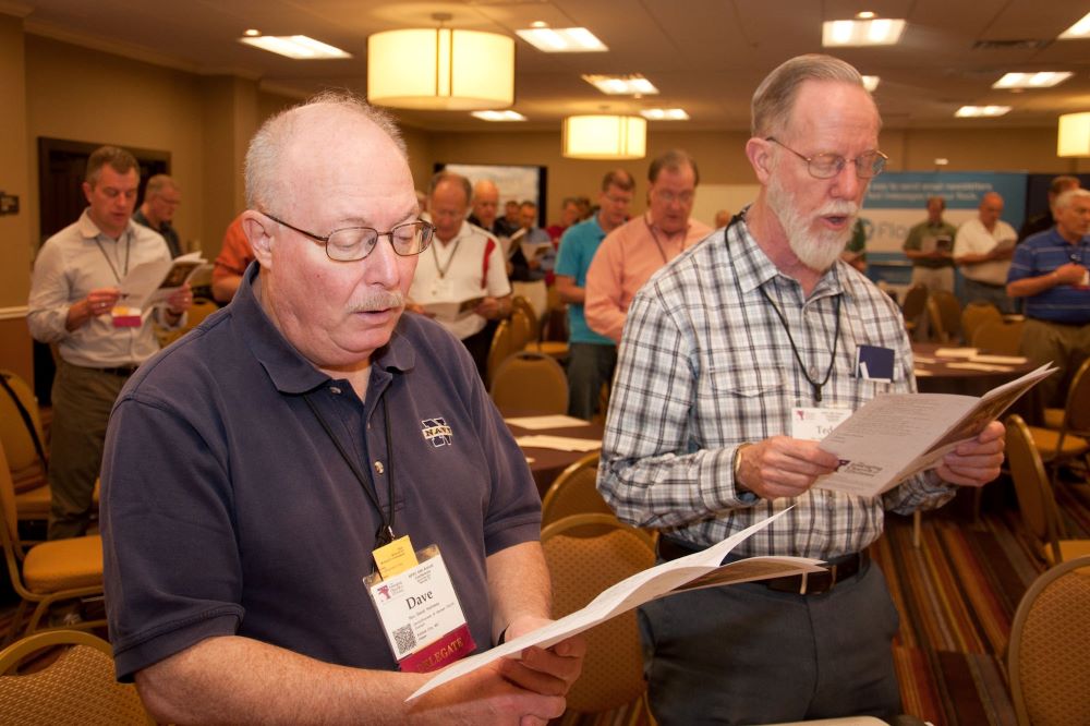 Frs. Dave Holloway and Ted Olson participate in morning prayers at 2012 event.