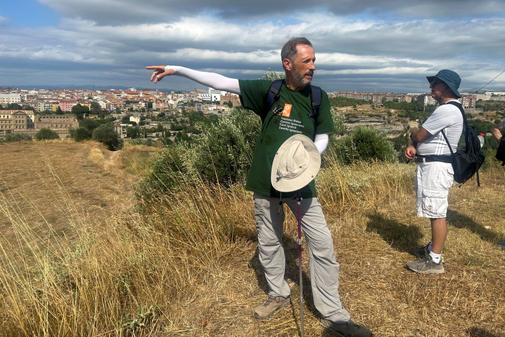 Jesuit Fr.  Josep Lluis Iriberri points toward Manresa, Spain.