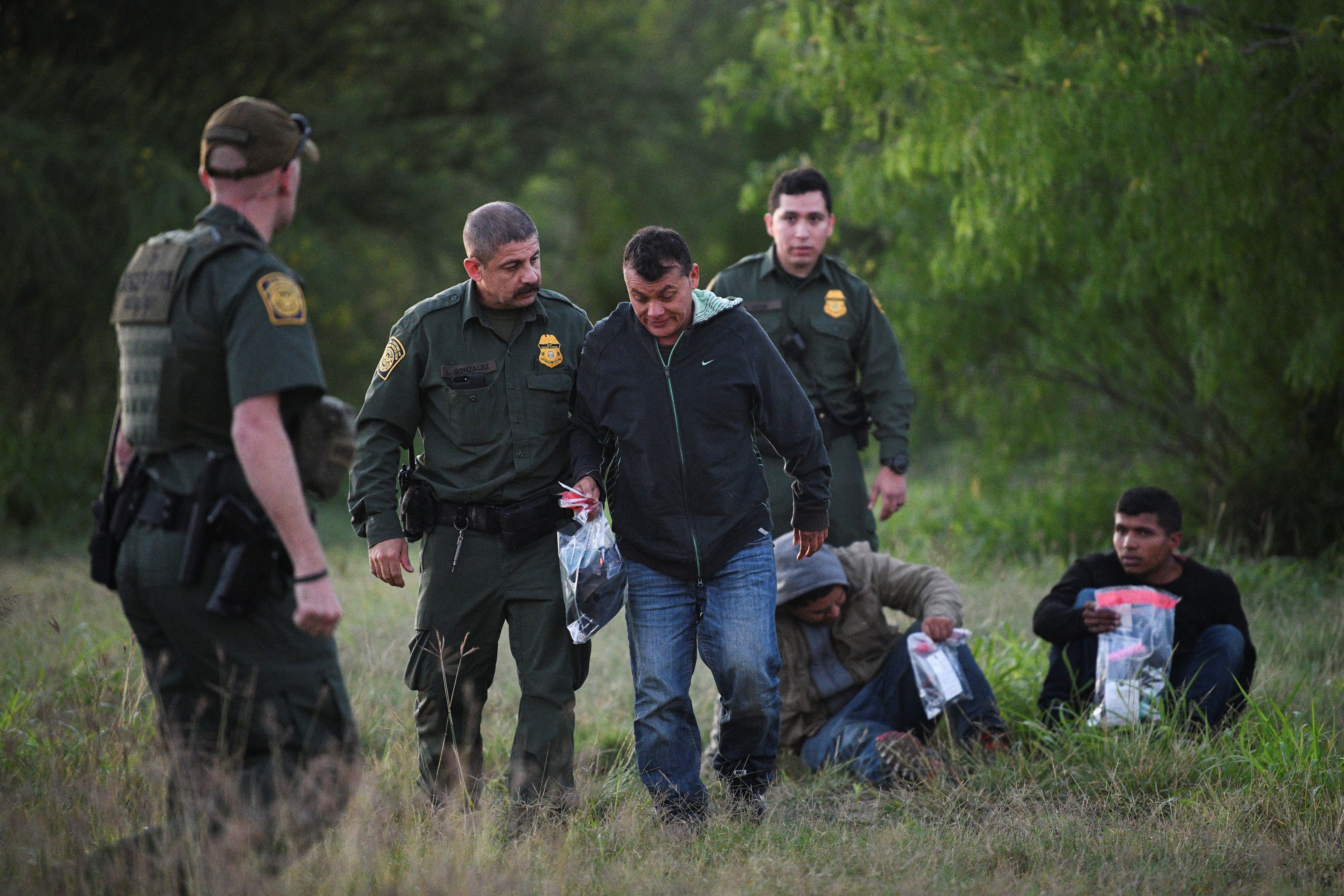  U.S. Border Patrol agents apprehend migrants in Mission, Texas, April 9, 2019, after they illegally crossed the U.S.-Mexico border, in this file photo. (OSV News photo/Loren Elliott, Reuters)