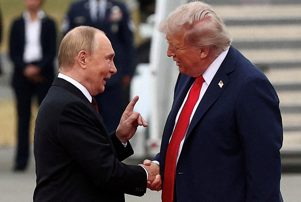 U.S. President Donald Trump and Russian President Vladimir Putin talk Aug. 15, 2025, after they arrived at Joint Base Elmendorf-Richardson in Anchorage, Alaska, for talks about bringing an end to the war in Ukraine. (OSV News/Reuters/Kevin Lamarque)
