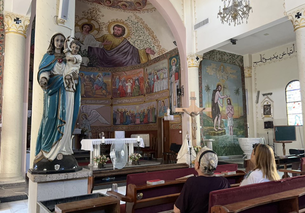 Catholics at Holy Family Church in Gaza pray the rosary on Aug. 18, the day Fr. Gabriel Romanelli received an evacuation order by the Israeli Defense Forces. (Courtesy of Fr. Gabriel Romanelli)