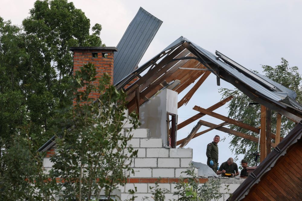Polish Army members inspect a damaged house in Wyryki, Poland, Sept. 10 after a drone or similar object struck a residential building.