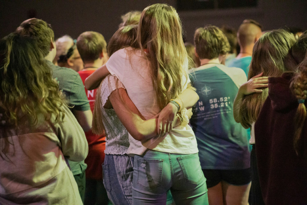Kids hugging at an event