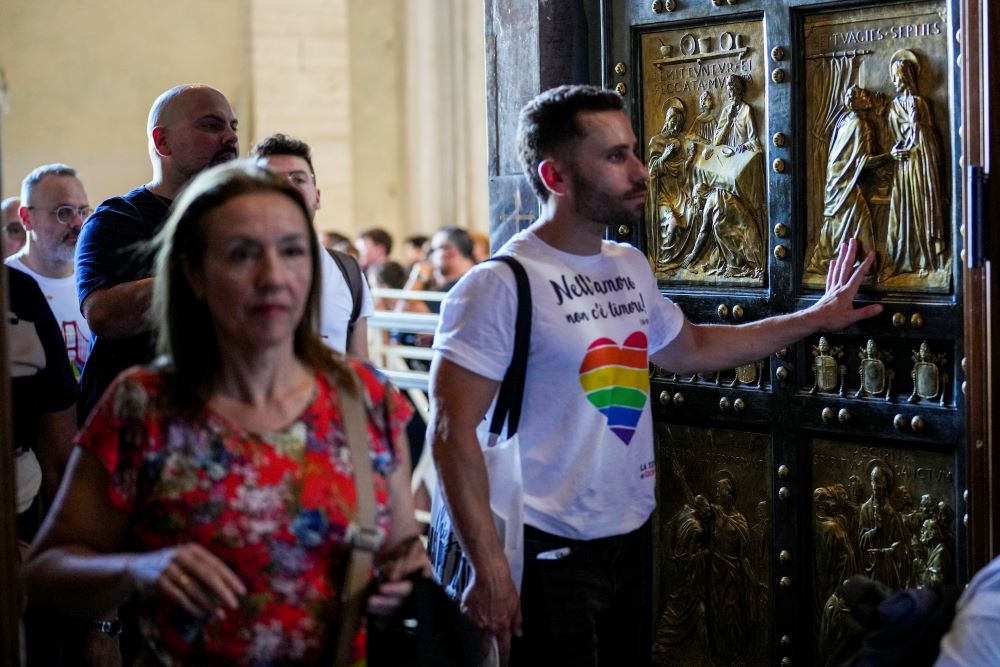 Hundreds of LGBTQ+ Catholics and their families joined a Holy Year pilgrimage to Rome walk through the Holy Door of St. Peter's Basilica at the Vatican Sept. 6 (AP/Andrew Medichini)