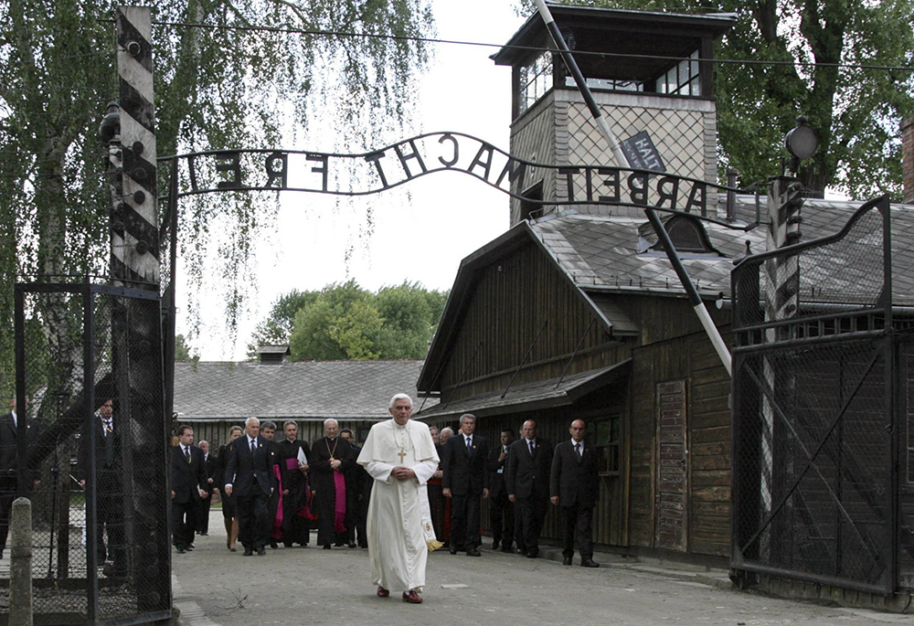 Pope Benedict XVI walks through the gate of the Auschwitz Nazi concentration camp in Oswiecim, Poland, in this May 28, 2006, file photo. (CNS photo/OSV News/Reuters/Pawel Kopczynski)