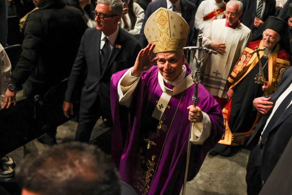 Pope Leo XIV greets the faithful as he walks after presiding over the Holy Mass at the Volkswagen Arena.
