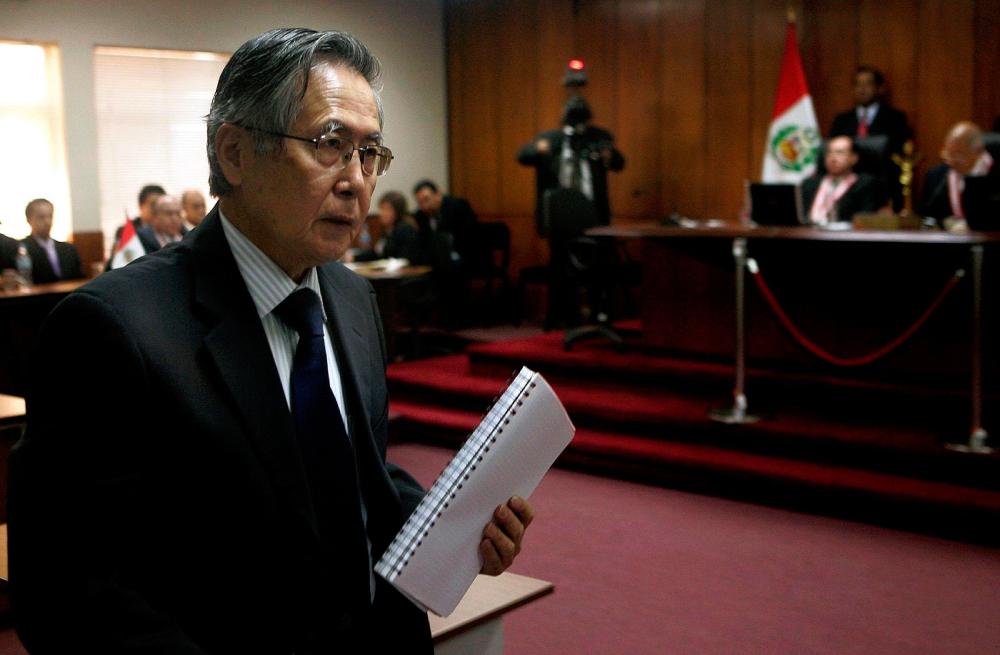 Former Peruvian President Alberto Fujimori stands after being sentenced during his trial at the Special Police Headquarters in Lima, Peru, April 7, 2009.