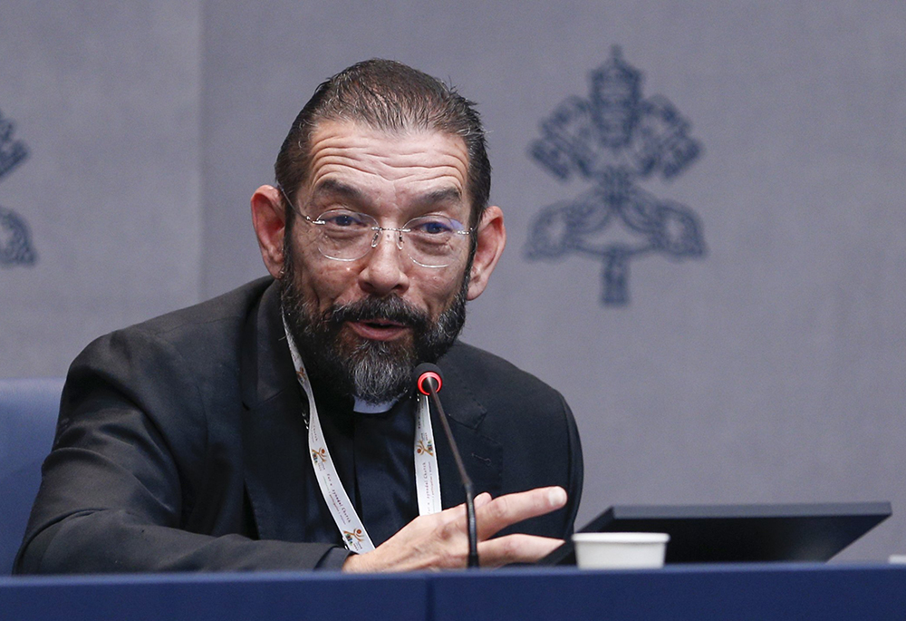Bishop Daniel Flores of Brownsville, Texas, speaks at a news conference in the Vatican press office Oct. 3, 2024, during the Synod of Bishops. (CNS/Robert Duncan)