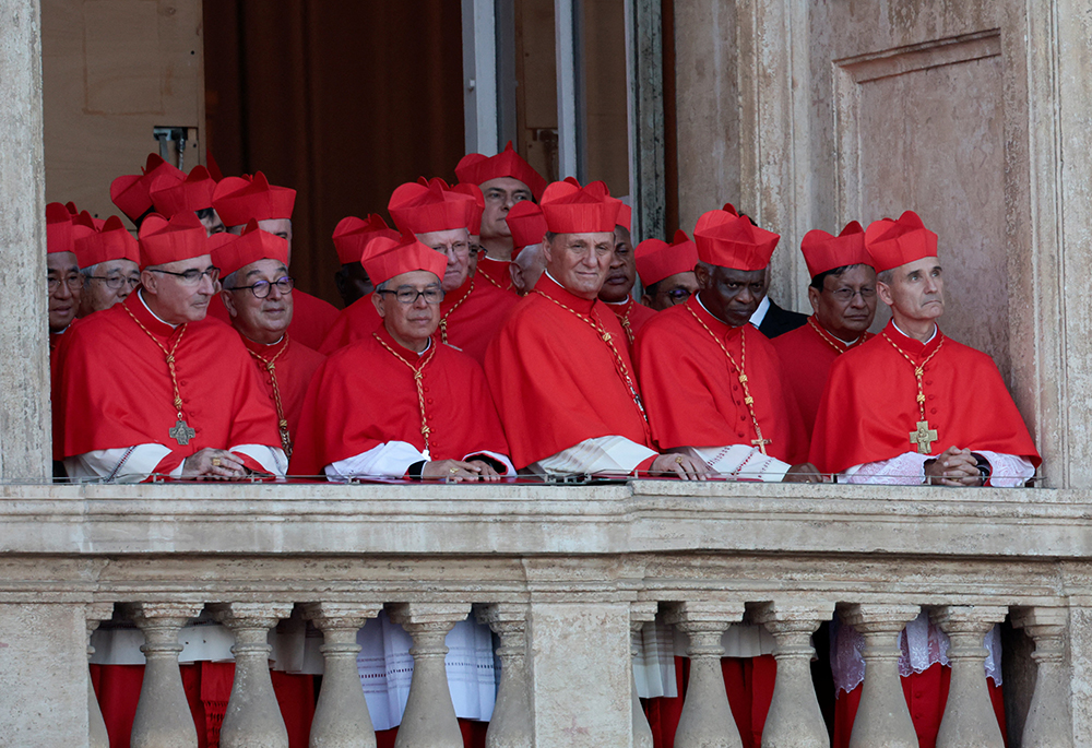 Cardinals stand on the central balcony of St. Peter's Basilica at the Vatican May 8, 2025, after Cardinal Robert Francis Prevost, who chose the papal name Leo XIV, appeared on the balcony following his election during the conclave. (OSV News/Reuters/Remo Casilli)